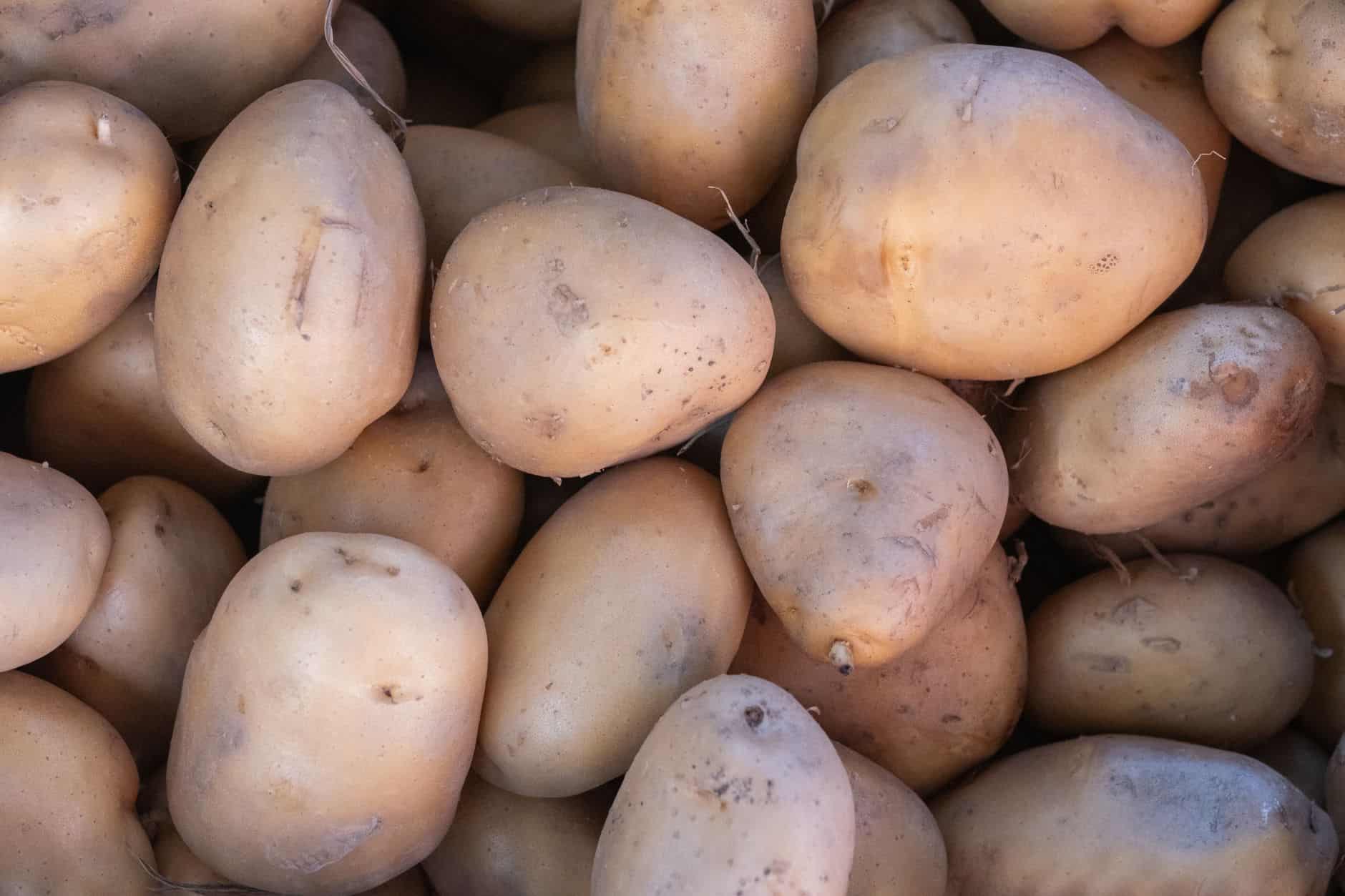 Close-up of fresh organic potatoes at a local market in Bornova, İzmir, showcasing healthy produce.