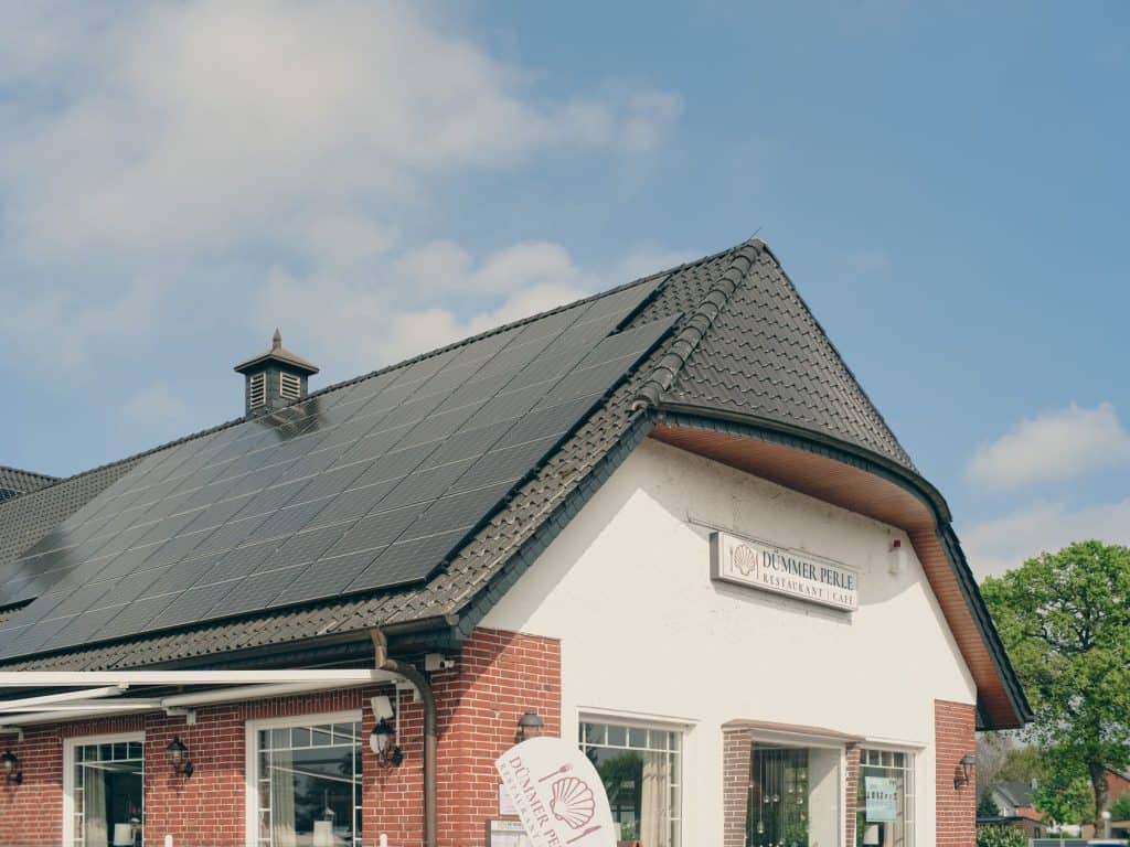 Solar panels installed on a house roof for renewable energy.